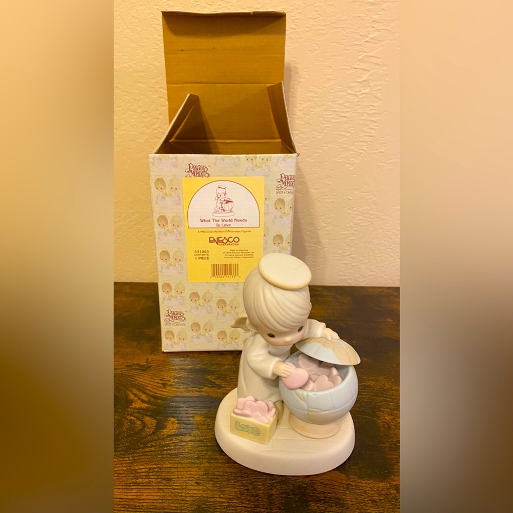 Artwork by the late Sam Butcher. Retired Precious Moments Figurine.